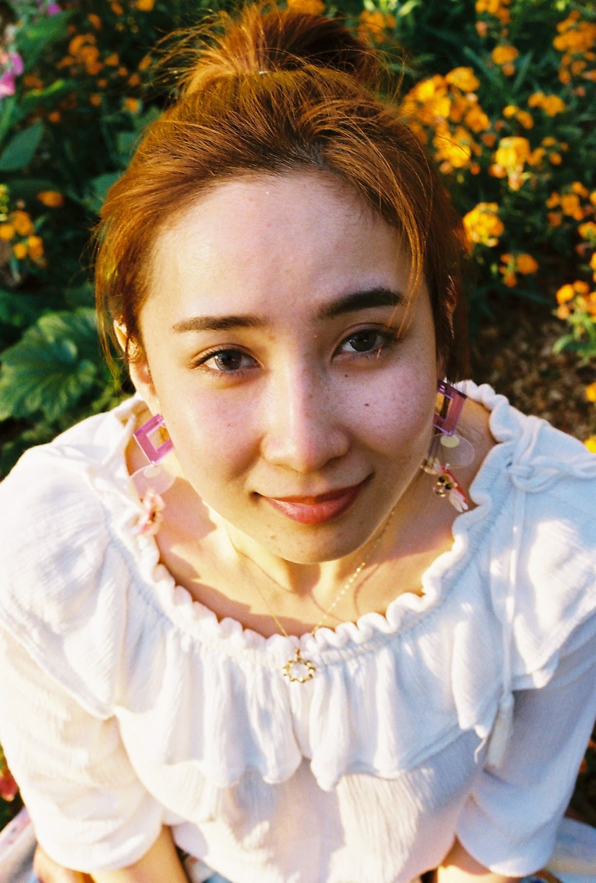 Portrait of a person looking up towards the camera.