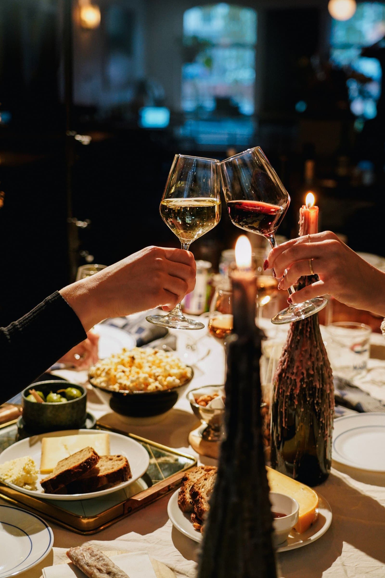 Guests dining around a warmly lit table.
