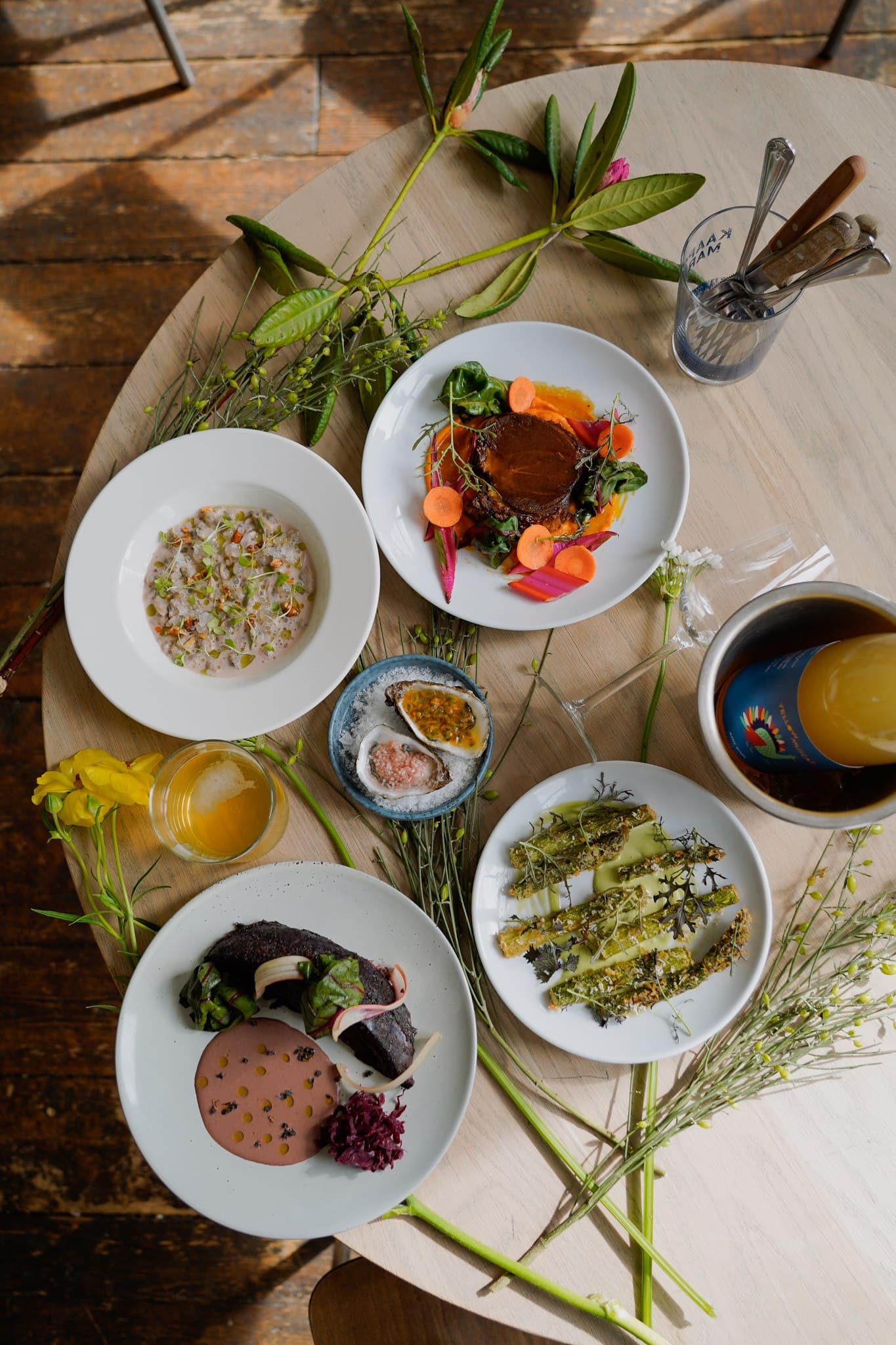 Several dishes arranged on a wooden table, photographed from above.