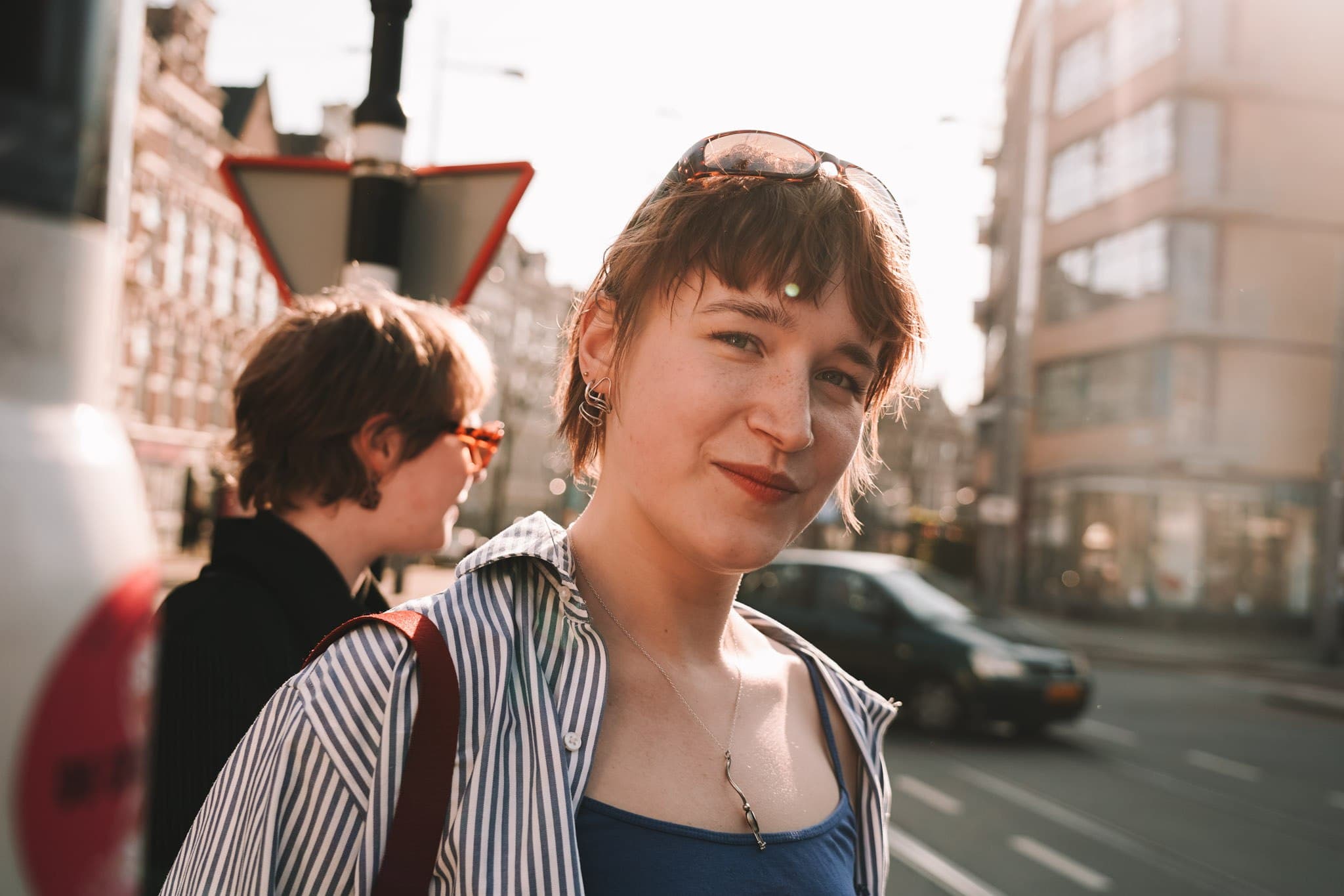 Sunlit portrait on a city street.