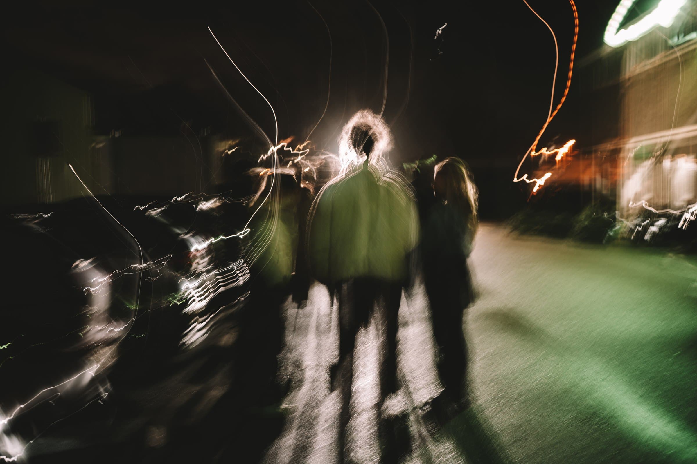 Motion-blurred live performance against dark stage lighting.
