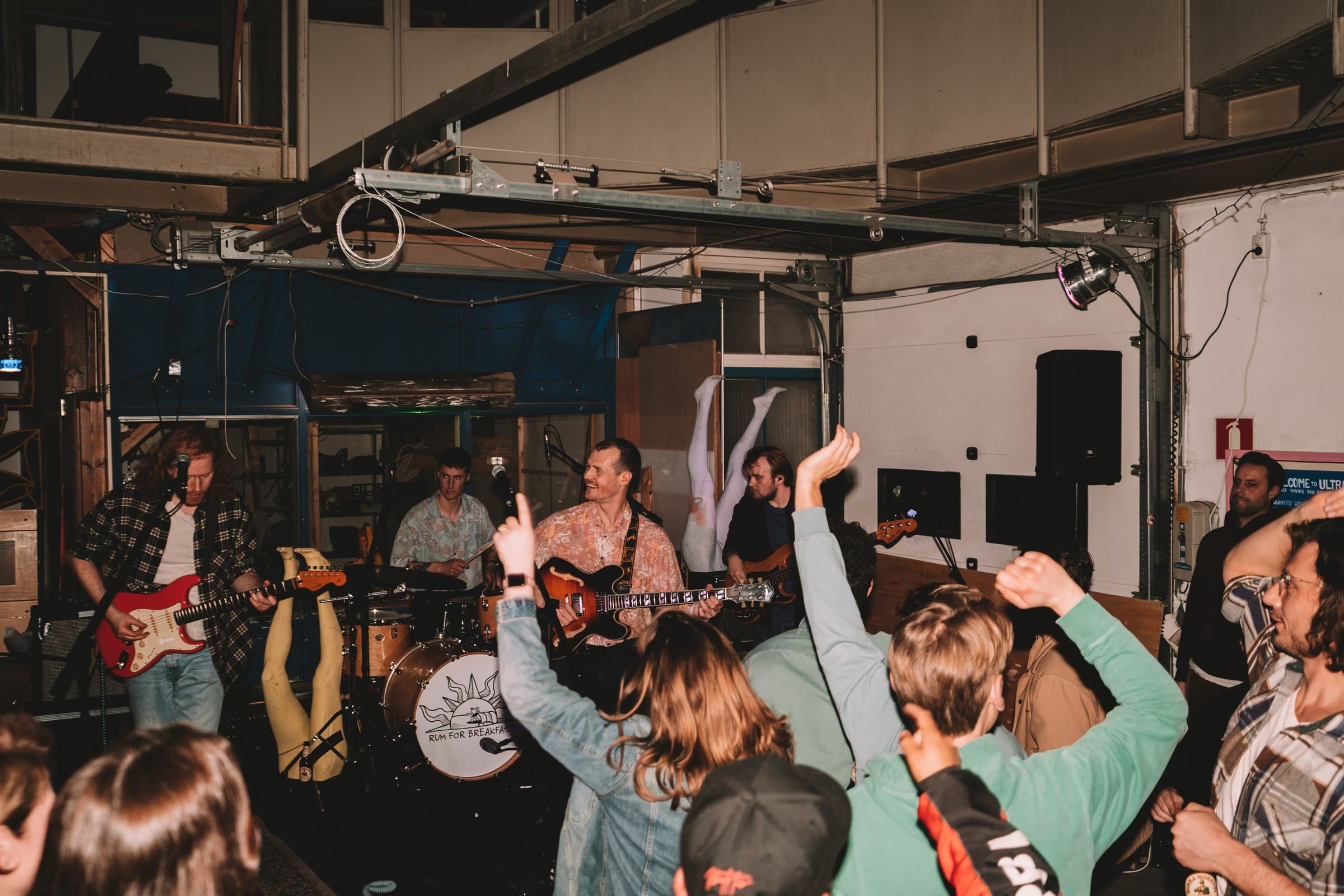 Audience and band during a live indoor performance.