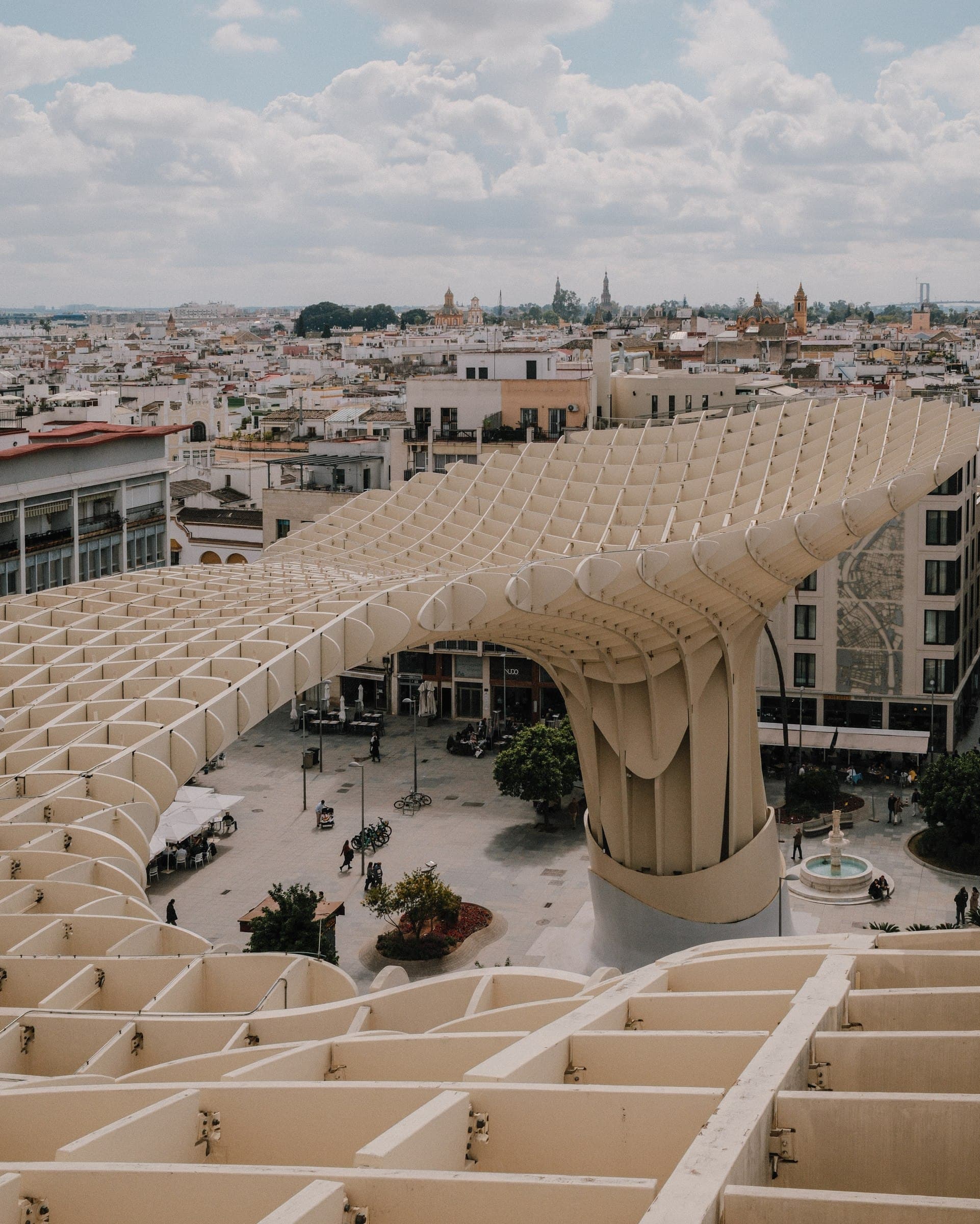 An elevated view along the curving structure of the Setas de Sevilla.