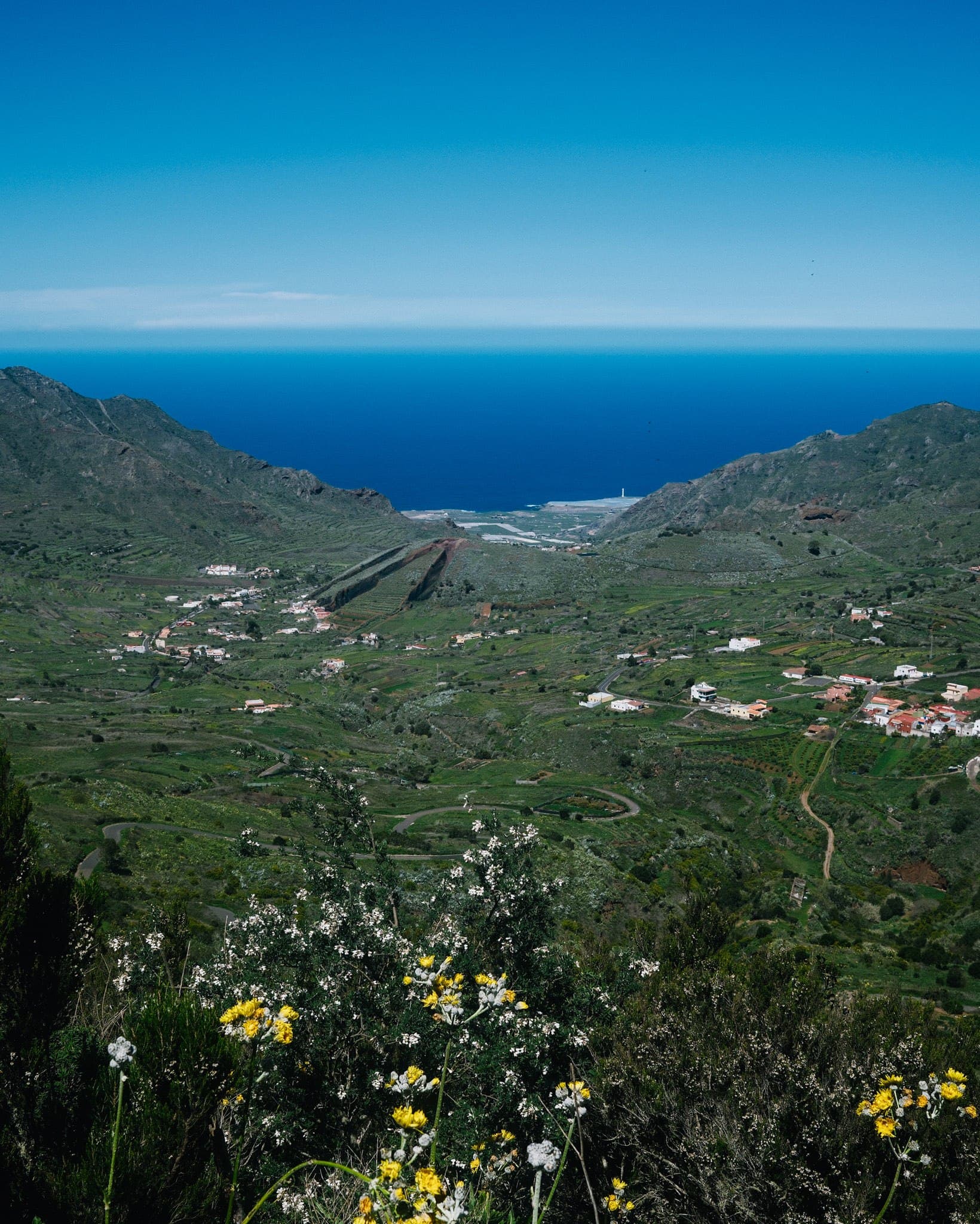 Green mountain slopes looking out towards the Atlantic Ocean.